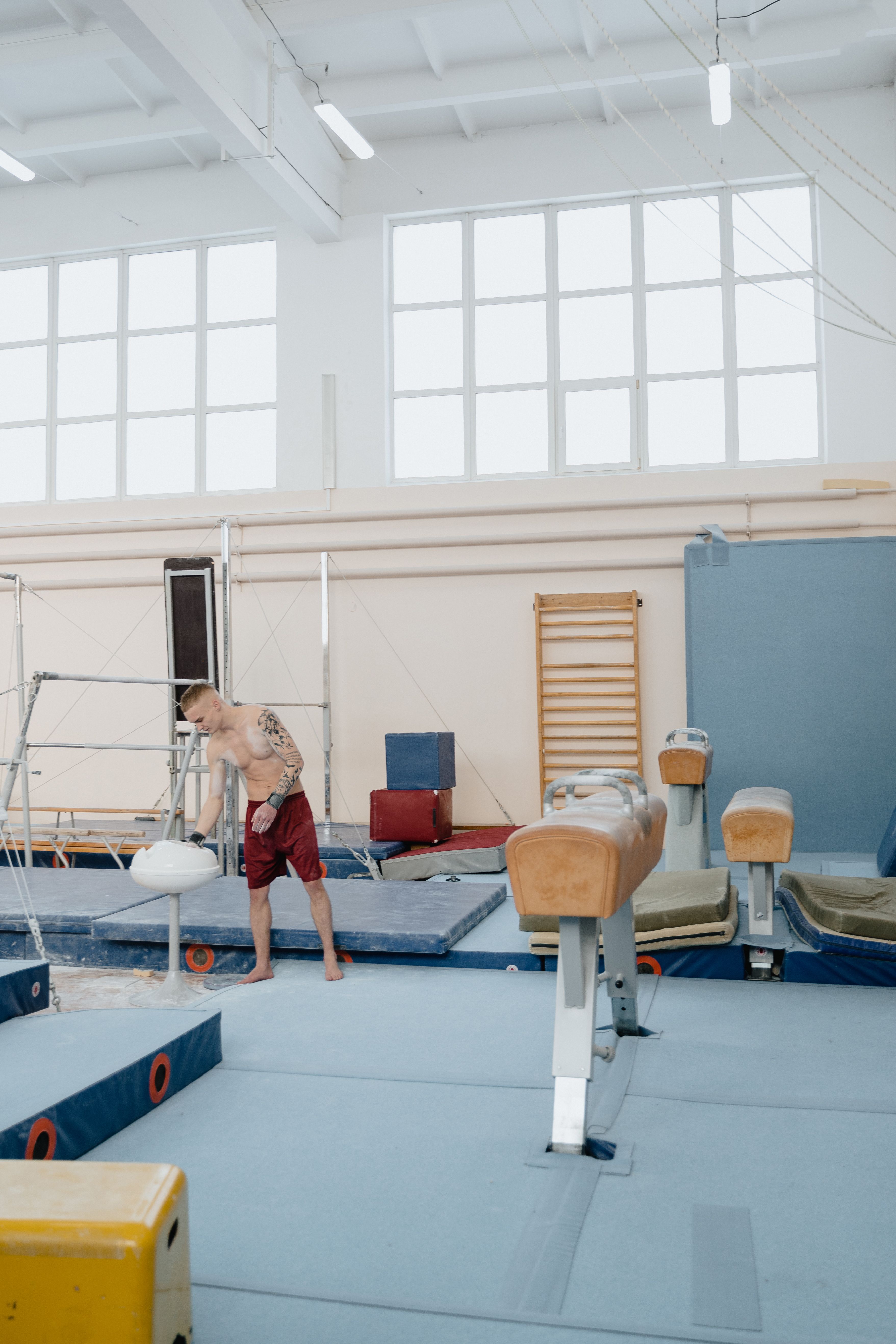 Child practicing gymnastics on beam