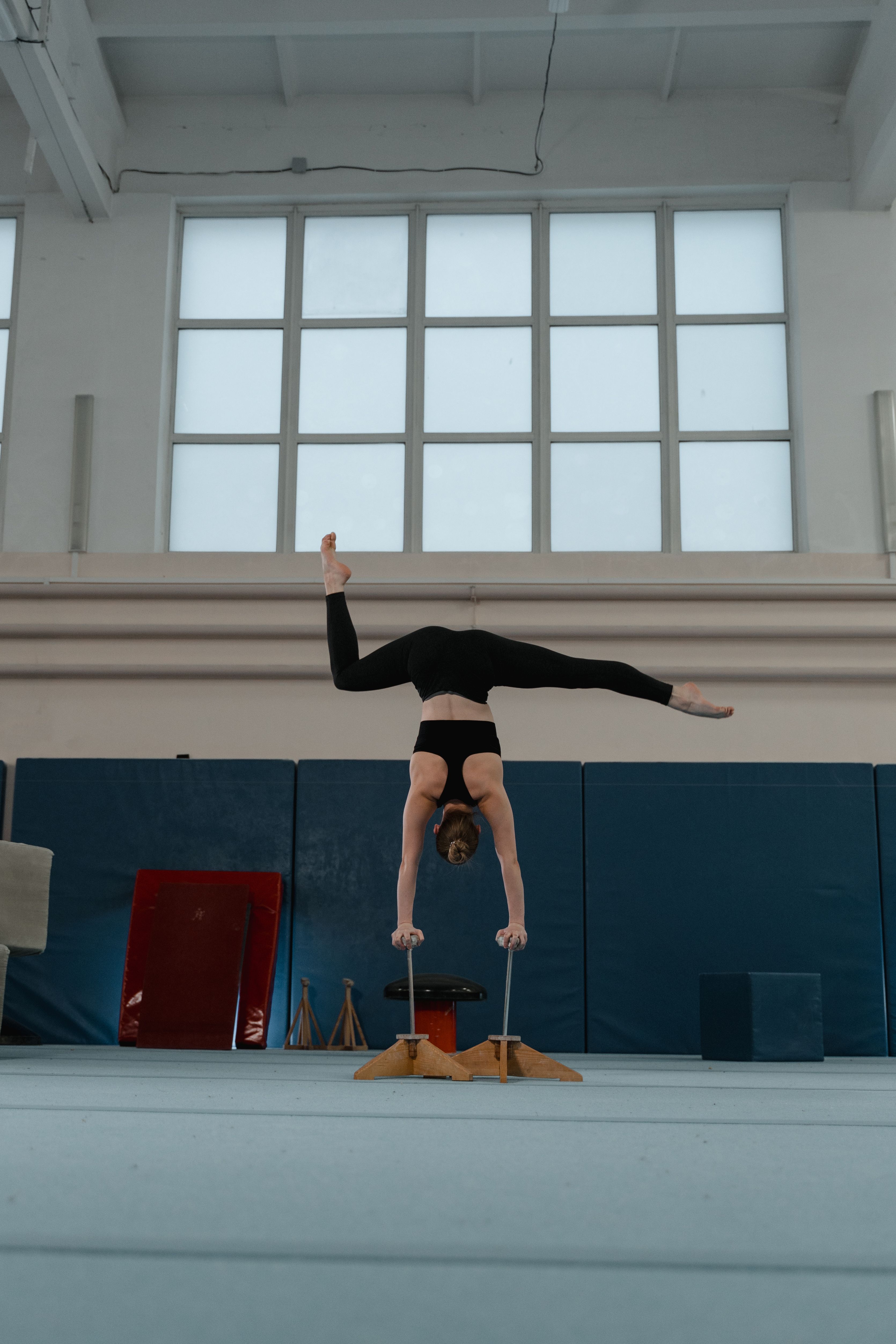 Children practicing gymnastics with instructor